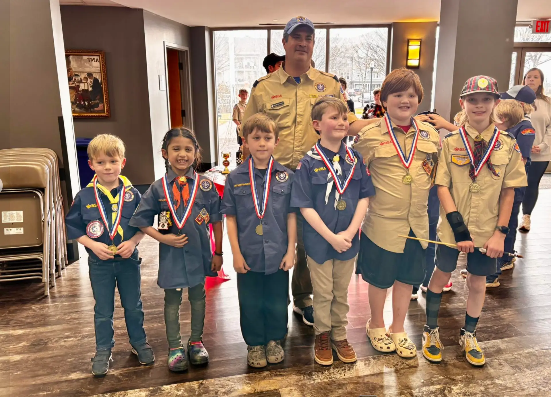 Cub Scouts wearing medals after a pack derby