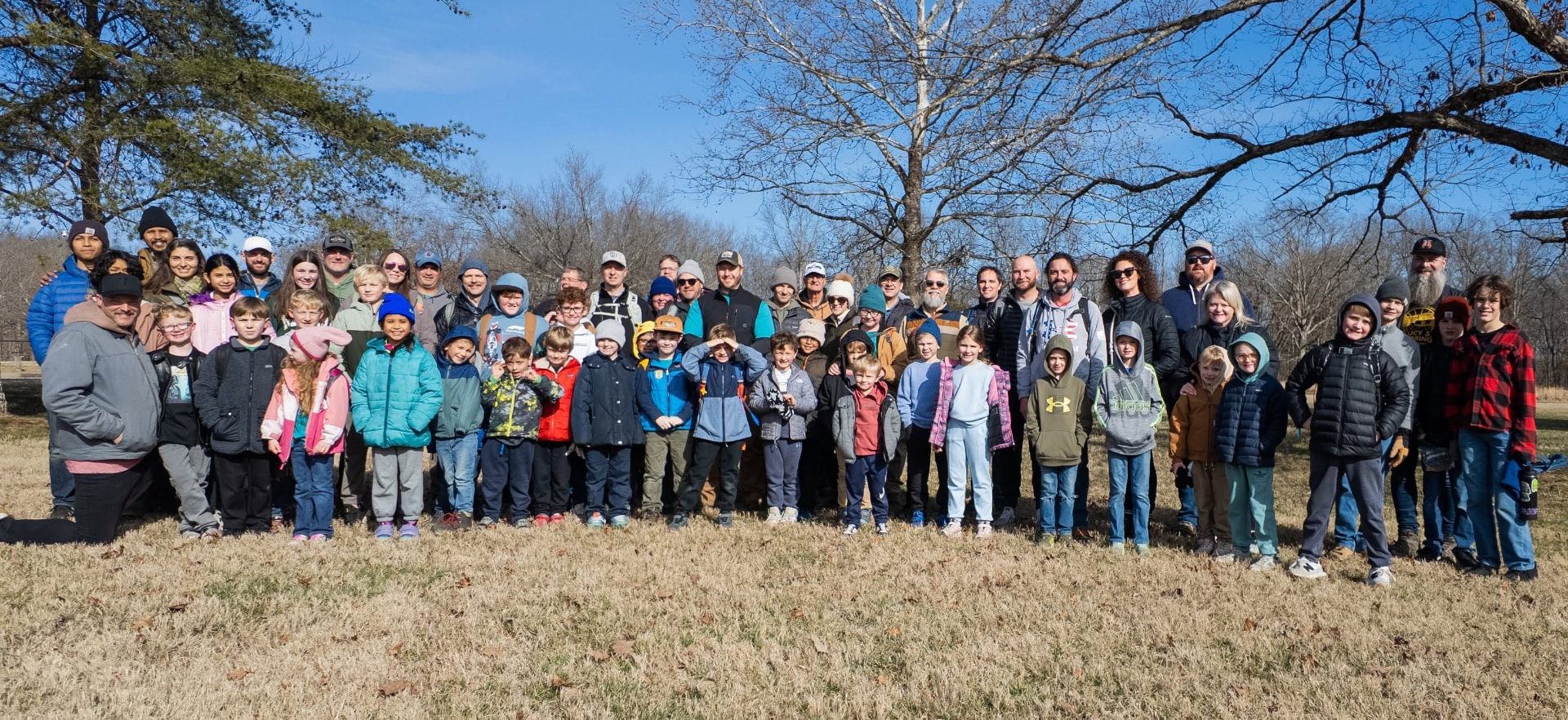 Pack 290 families gathered outdoors on a winter hike